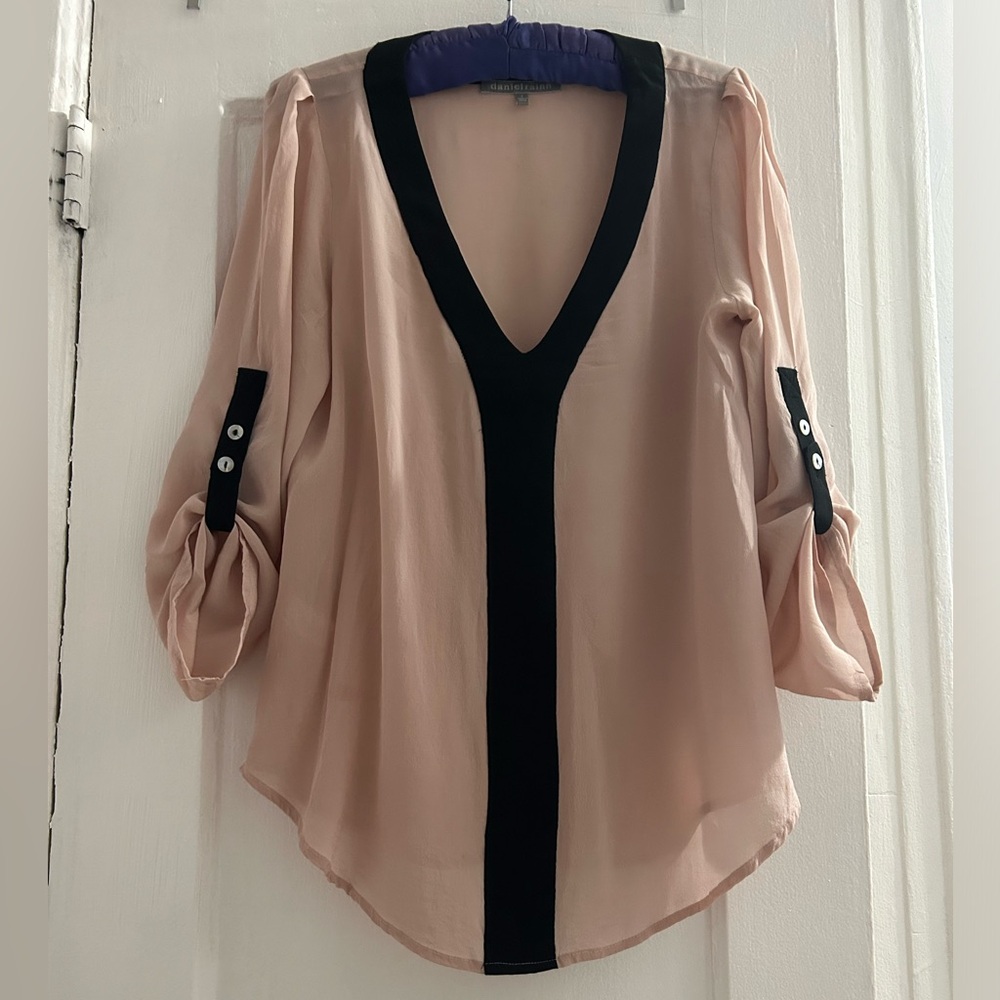 Pale pink blouse with black accent